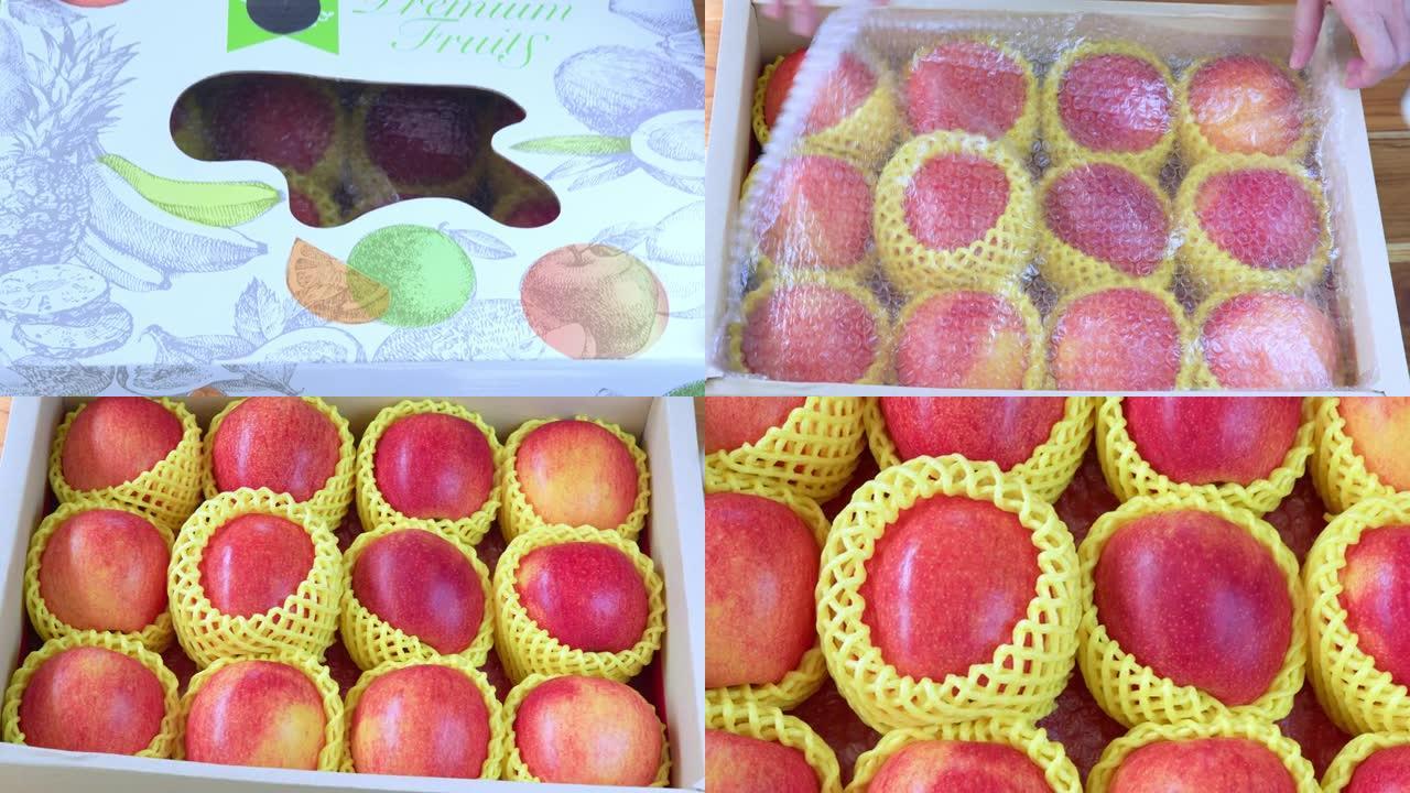 包装中的新鲜红苹果准备出售，美国。红色嫉妒苹果在包装箱中发货。