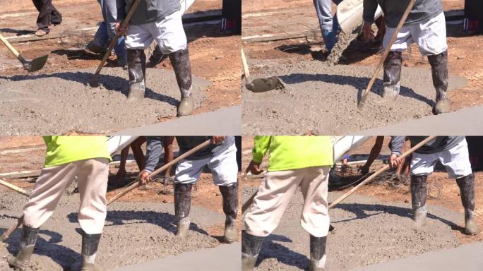 工人用水泥搅拌车浇筑混凝土。