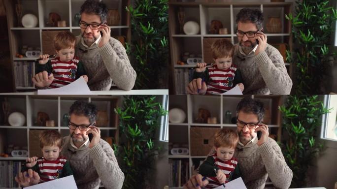 父亲在手机上聊天，而儿子在纸上画画