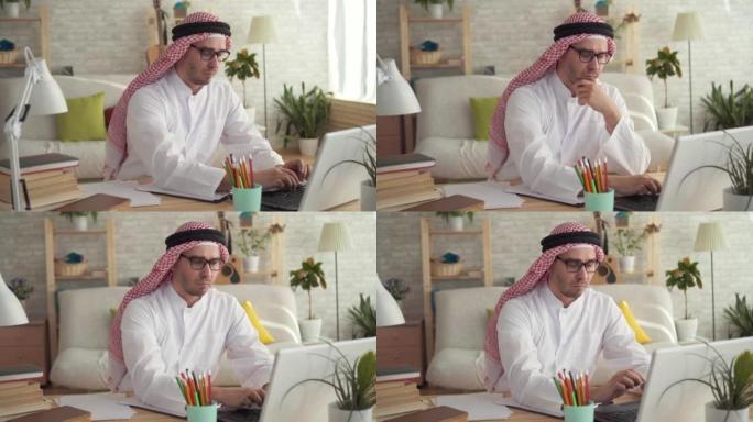 阿拉伯男子商人在笔记本电脑上工作