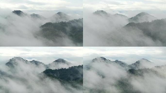 泰国宋卡府纳塔韦市宽隆山，晨间美景金光日出和薄雾在高山上流动