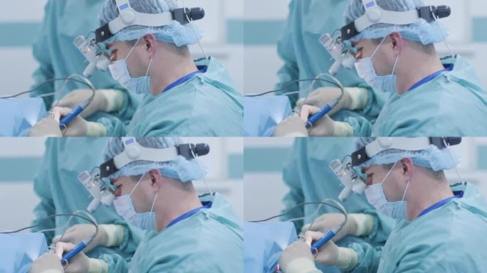 在深度麻醉下切除扁桃体的手术，外科医生使用最新的设备，冷等离子法，减少喉咙肿胀，医生使用新的探头，医