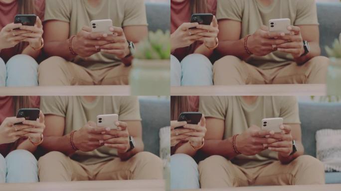 一对无法识别的夫妇坐在家里的沙发上并使用手机的4k视频片段