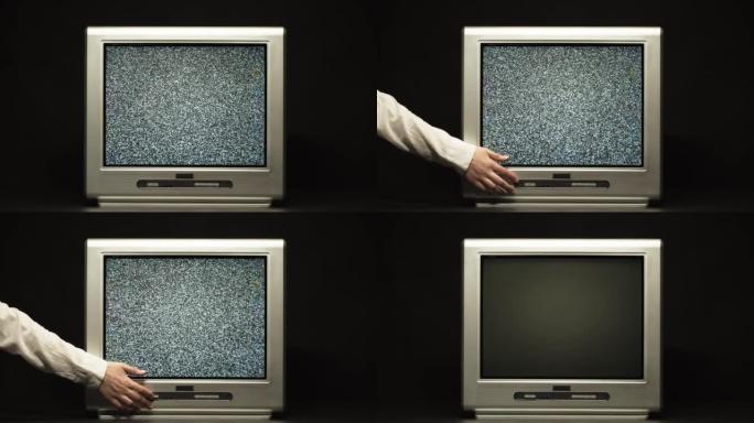 关闭黑色背景上的复古老式电视。具有灰屏，信号接收不良，波纹和干扰，摄影概念的老式电视的特写镜头