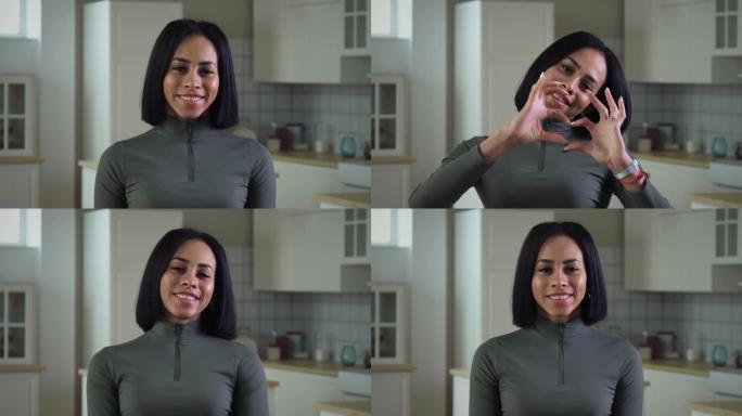非裔美国女孩用手做心脏标志