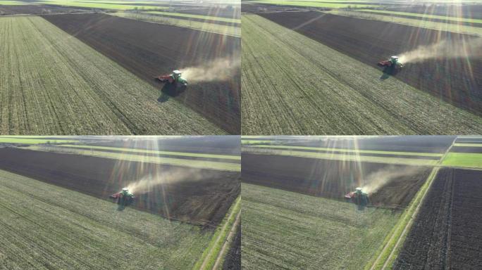 拖拉机在农田，农田上拖拉苗床的鸟瞰图