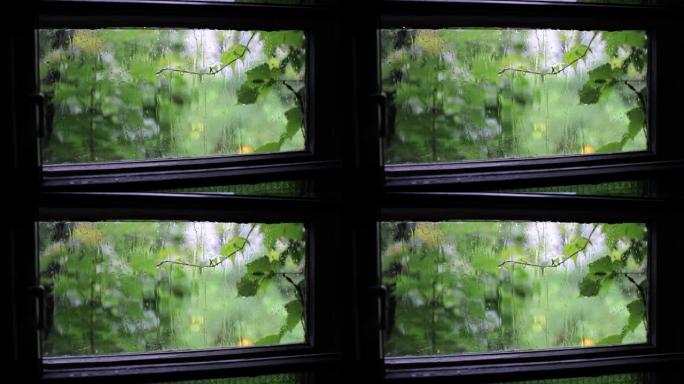 透过窗户看到的雨有三个盘子，关上了。适用于电影的一般开头或结尾