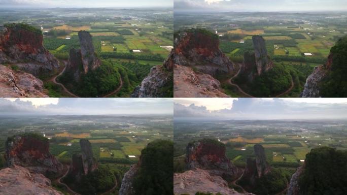 宋卡府奇怪形状山Khao Kuha的空中无人机日出场景。有绿色林木的山。泰国的自然景观背景。黄山。