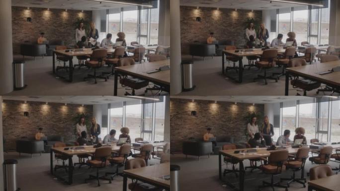 商务人士在现代开放式办公空间中互动