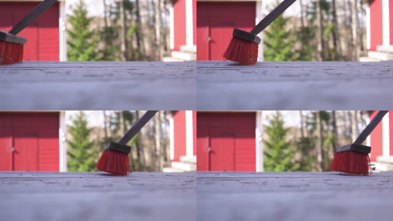 在瑞典春天的户外扫帚。农村。慢动作镜头。