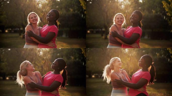健身朋友运动多样性女性拥抱公园