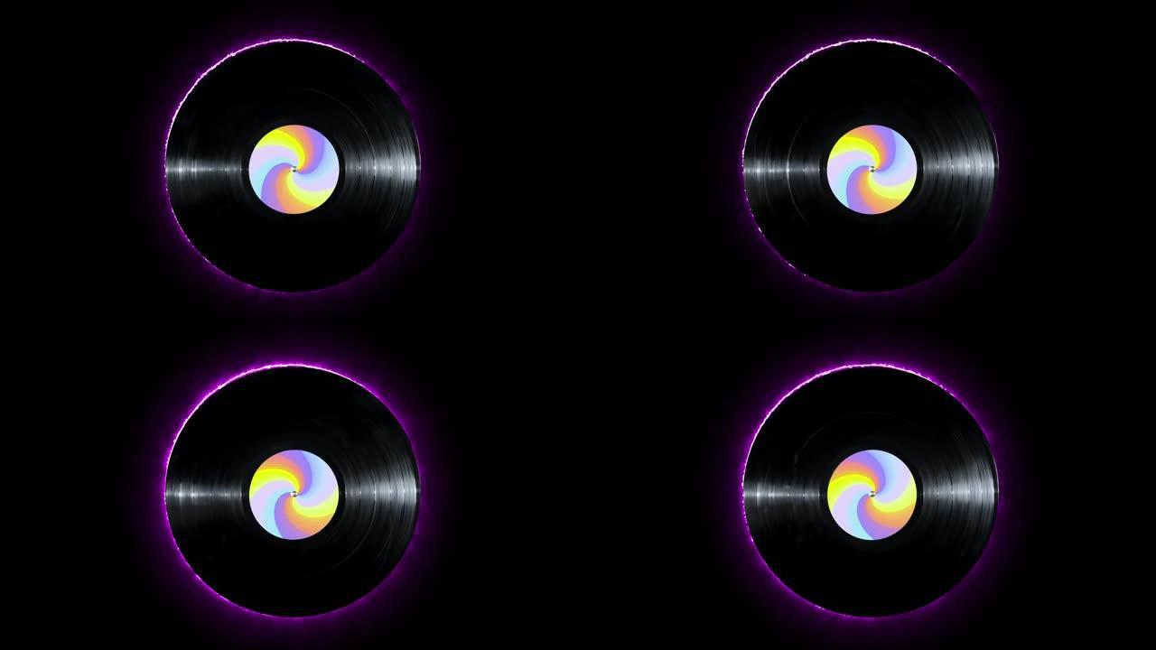 发光的紫色霓虹灯线乙烯基光盘，彩色贴纸在孤立的黑色背景上旋转。五