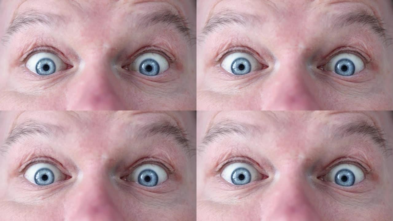 惊讶震惊的男人的蓝眼睛特写4k电影