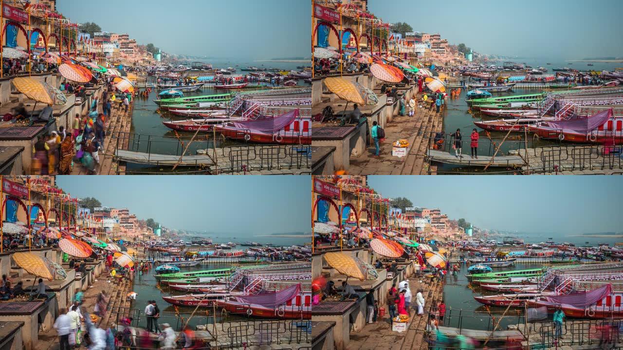 印度瓦拉纳西，瓦拉纳西城市景观的延时视图，显示了色彩丰富的船只和印度教徒在神圣的恒河中沐浴