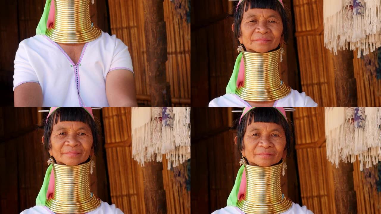 在泰国北部清莱附近的山地部落村，穿着传统服装和颈环的凯伦长颈女子