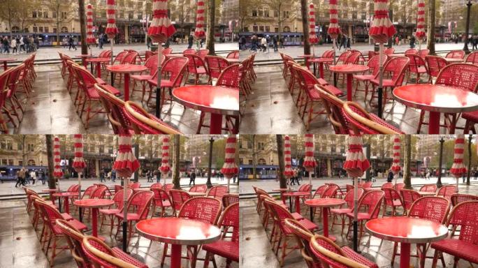 雨滴倒的湿红色桌子空了在巴黎市中心香榭丽舍大街的室外餐厅