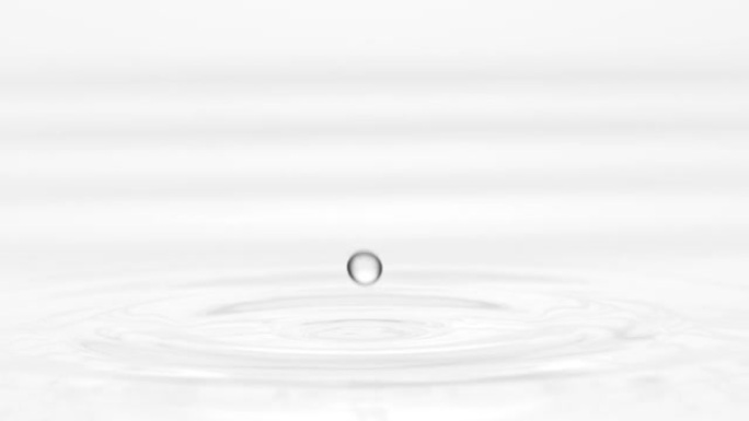 灰色液体滴落在液体表面上，形成圆圈