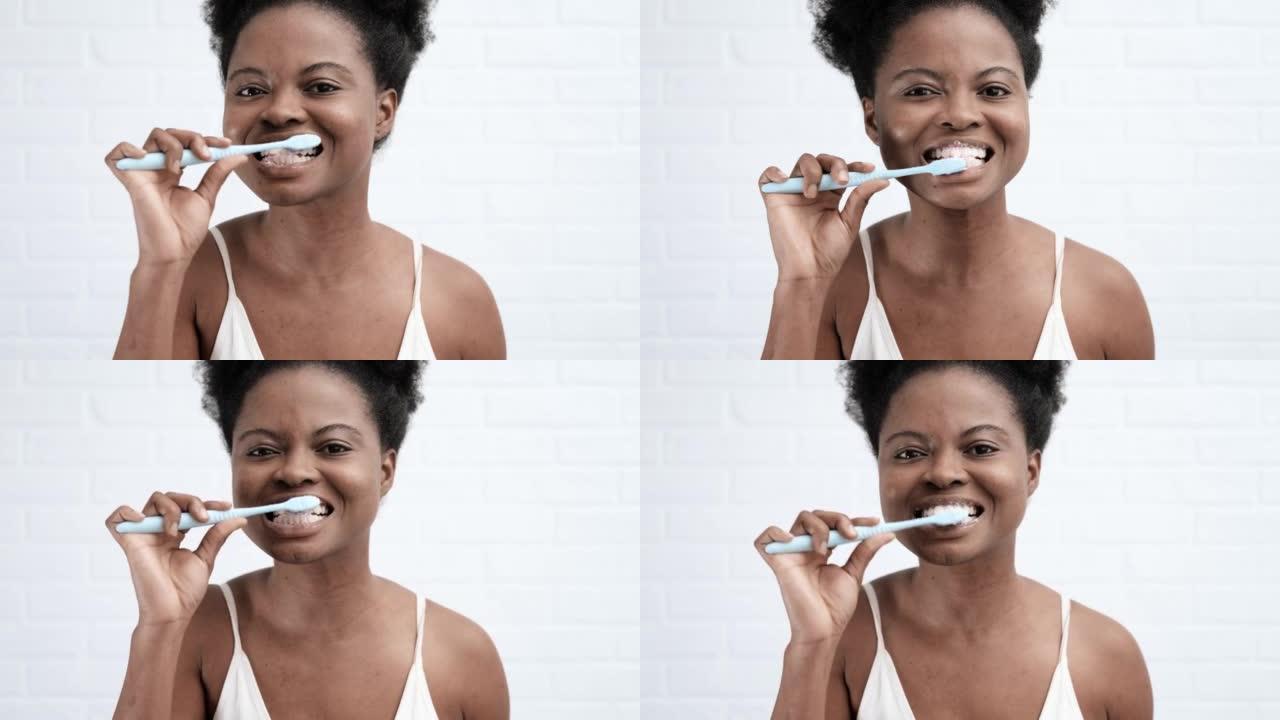 肖像黑人非洲裔美国女孩刷牙，女人在相机里看，牙科，口腔科，牙科护理和牙刷卫生