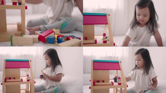 亚洲小女孩在家玩木头玩具