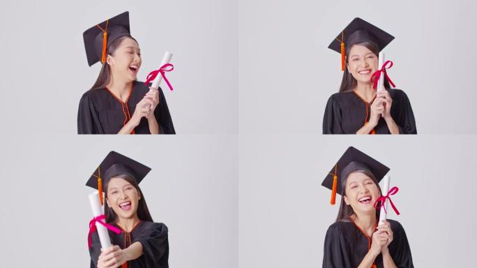 美丽迷人的亚洲女人毕业于帽子和礼服微笑，手里拿着认证的感觉如此自豪和幸福，孤立在白色背景上，教育成功