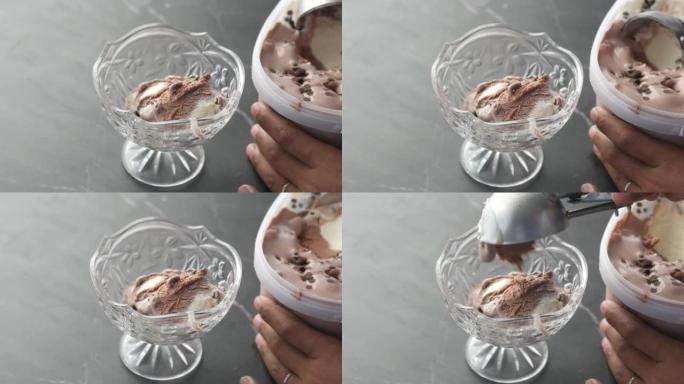 用勺子从碗里手工采摘冰淇淋