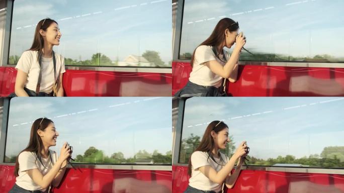 亚洲女性旅游火车旅行，谈话快照，城市视野中的交通。