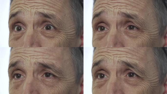 老人眼睛的情感肖像，特写，白色背景