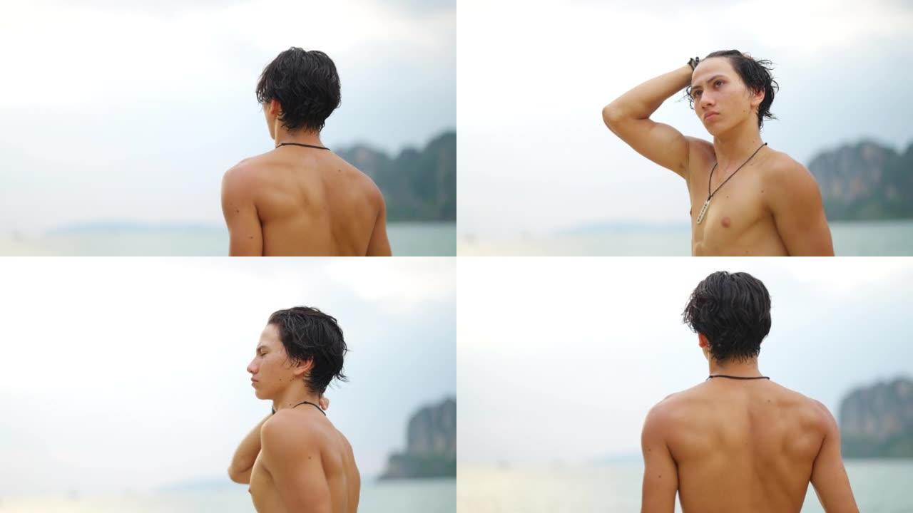 夏季日落时，4k年轻的亚洲男子在热带泻湖岛海滩的海里游泳。