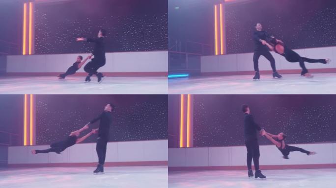 一对花样滑冰运动员在溜冰场上旋转，女人进入死亡螺旋，在空中盘旋，平行于两腿结冰，男人用手扶着她。花样
