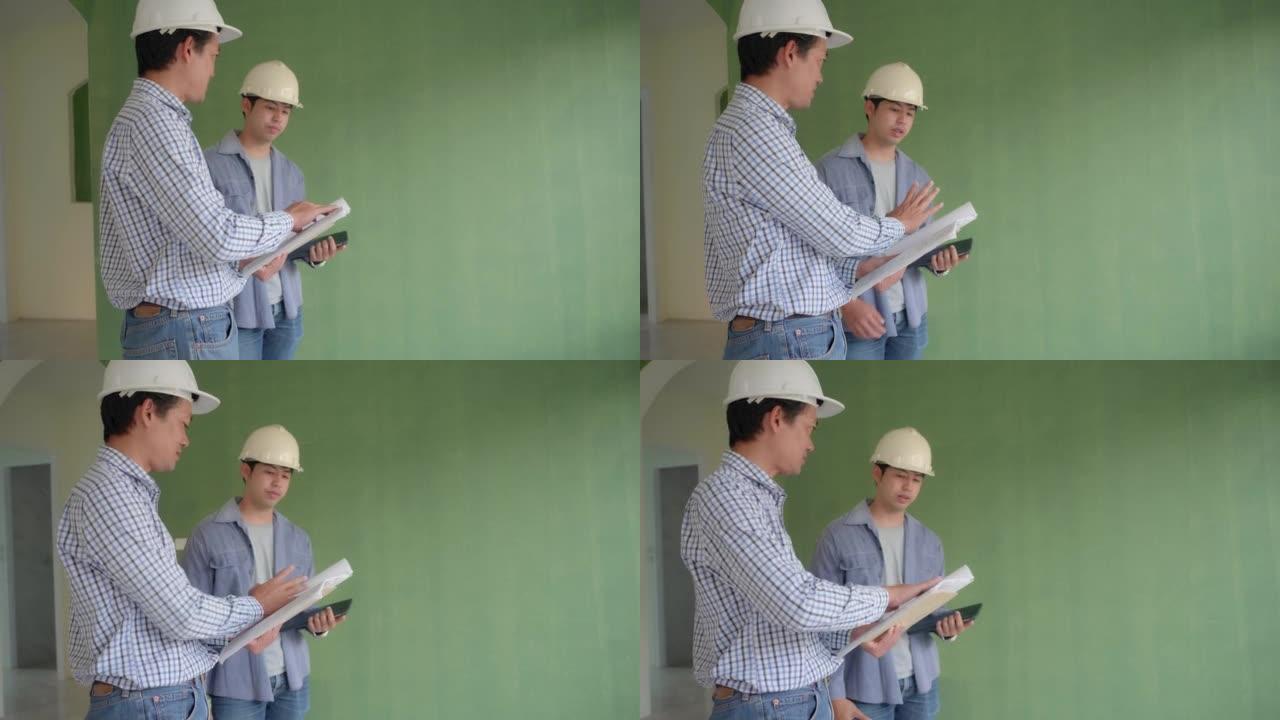 亚洲男子工程师检查正在建造的室内房屋
