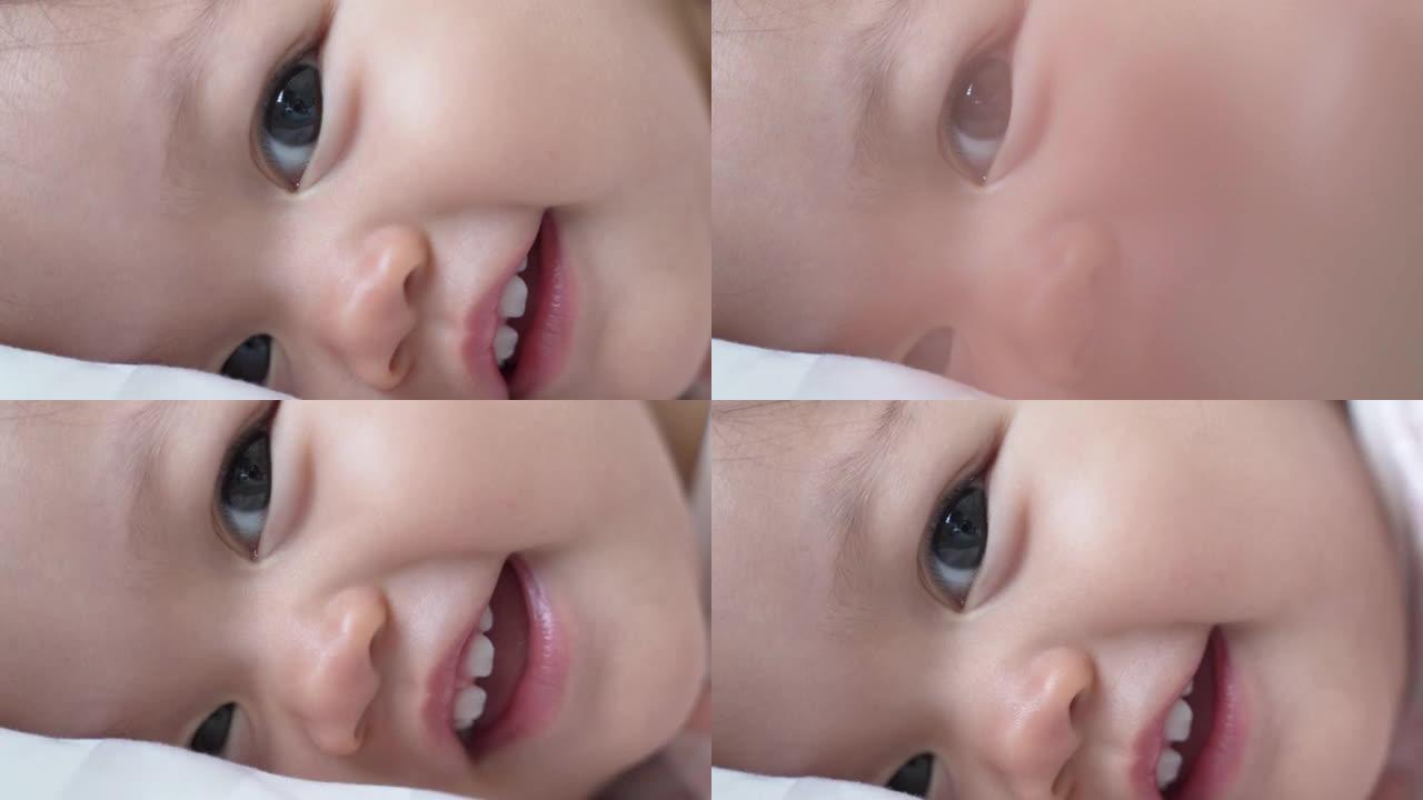 特写婴儿婴儿眨眼，喝完奶瓶后微笑。孩子眨眼。快乐的微笑，娃娃脸。亚洲儿童。