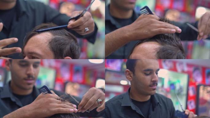 理发师用剪刀剪头发特写
