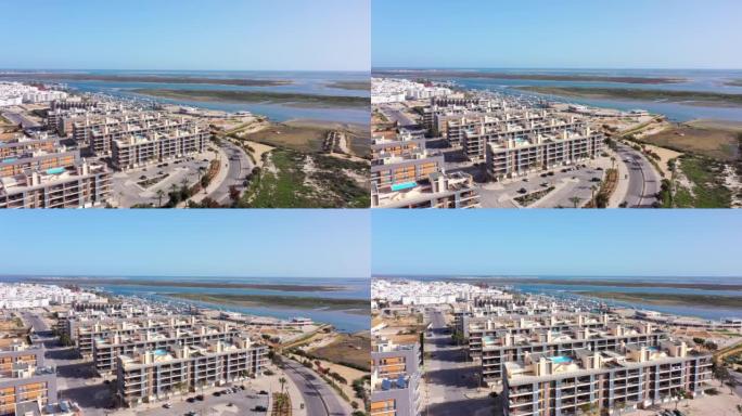葡萄牙市区的鸟瞰图房屋配有俯瞰大海的现代基础设施游泳池。葡萄牙南部城市奥豪里亚福尔摩沙
