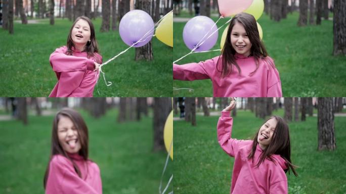 穿着粉色运动衫的可爱黑发少女玩热气球。暑假快乐，假期快乐。慢动作