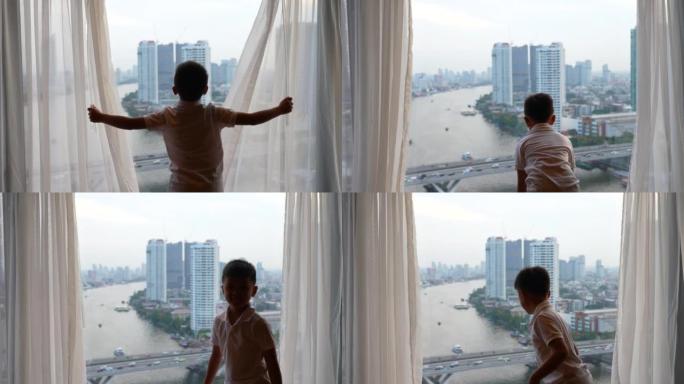 亚洲孩子在酒店拉开帷幕。开始新的一天，假期和发现的概念