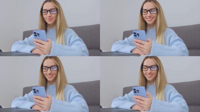 年轻女子在智能手机上浏览互联网。美丽的金发女性使用社交媒体应用程序在线交流现代蓝色手机连接到快速互联