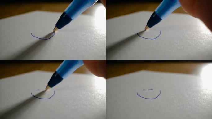 圆珠笔在纸上画笑脸
