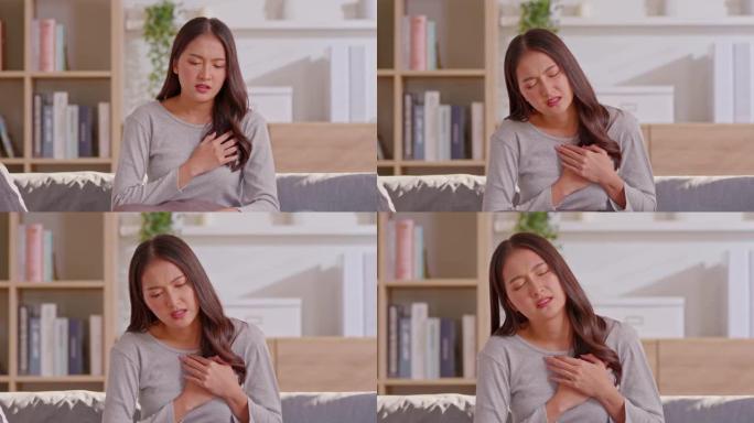 一名亚洲妇女有心脏病发作的症状，这是使人死亡或紊乱的主要结果。有许多症状，如胸痛，胸部压力和背部不适