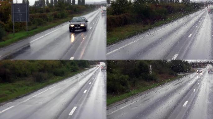 通过满是飞溅的公共汽车的挡风玻璃可以看到迎面驶来的汽车