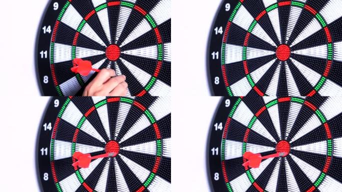 红色飞镖击中中央飞镖的录像