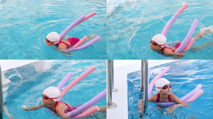 带面部医用防护面罩的水中女教练，在游泳池室内游泳池给孩子上游泳课