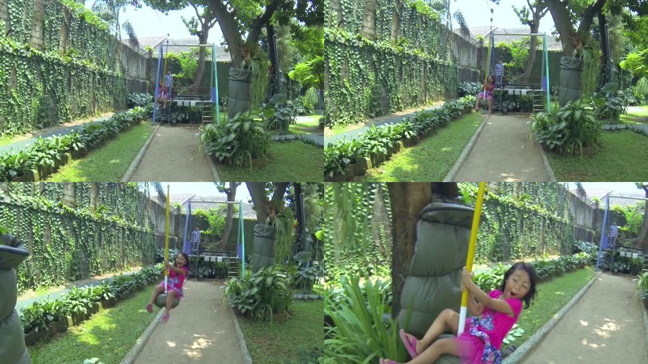 一个小女孩在儿童游乐场骑飞狐游戏设备的录像。