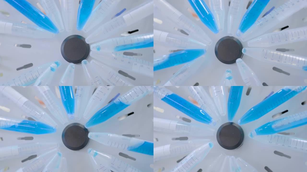 数字圆管旋转器混合蓝色液体-特写细节视图
