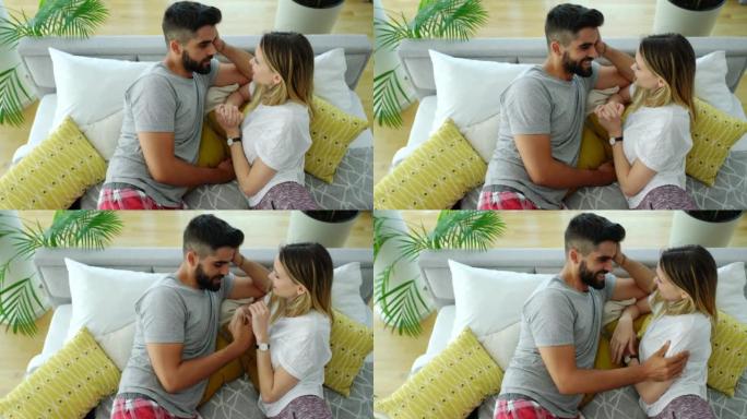 Young couple relaxing in bed.