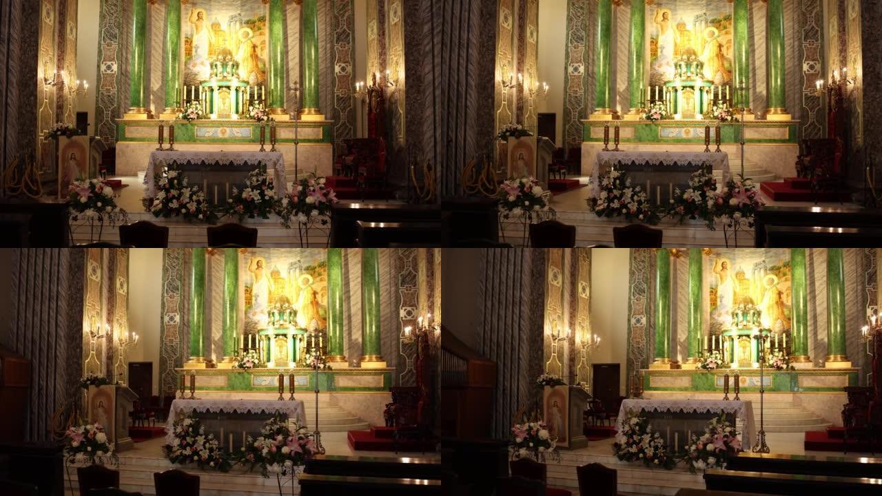 美丽的天主教堂祭坛内部装饰和蜡烛