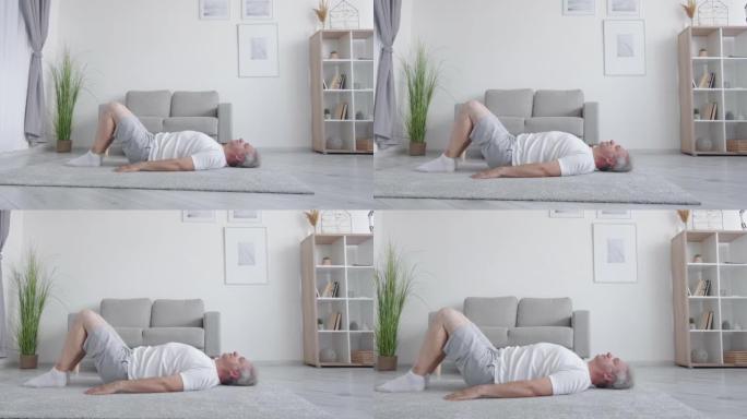 家庭健身训练男子躺着臀部抬高运动