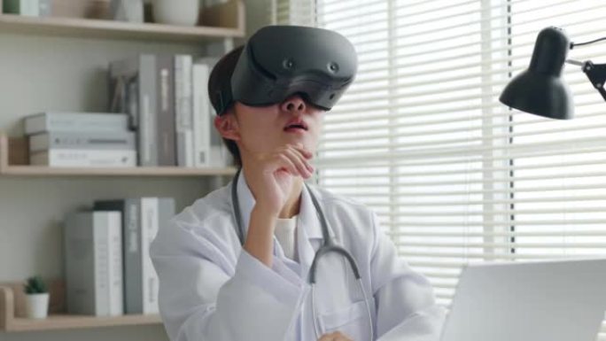 亚洲女医生使用3d VR虚拟现实分析体检，在医疗办公室医院报告