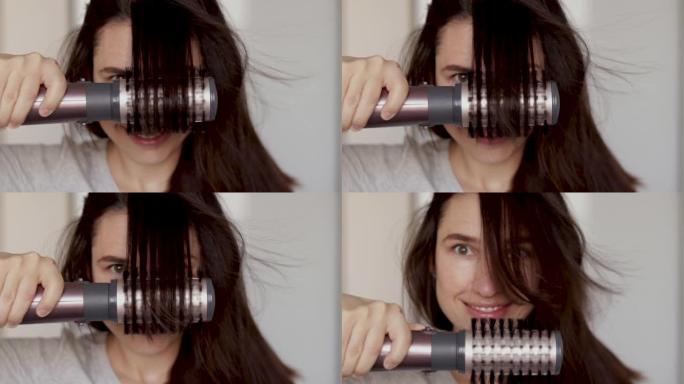 女人使用rorative hair styler刷子烘干机微笑的女性。女孩按摩头皮头发生长刺激