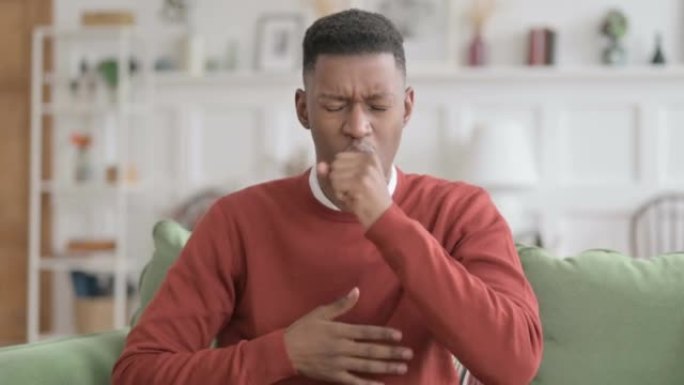 生病的非洲男子咳嗽的肖像