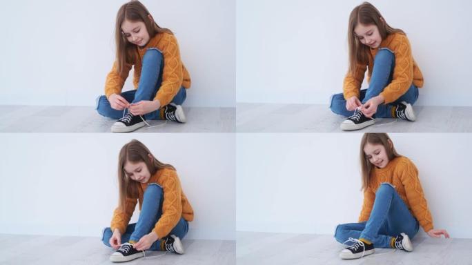 小女孩学习系鞋带